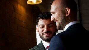 A wedding photo of 2 grooms at a same sex wedding in Derby